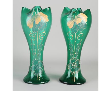 Two antique mouth-blown Art Nouveau glass vases with enamel floral decor.&nbsp;Circa 1900. Dimensions: H 26 cm.&nbsp;In good 