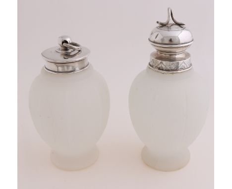 Two milk glass convex tea caddy with silver cap.&nbsp;One slightly dented and has a small break in the edge.&nbsp;Otherwise i