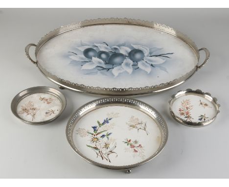 Four antique ceramic serving trays with nickel-plated rims.&nbsp;Germany.&nbsp;Dimensions: Ø 13 - Ø 50 cm.&nbsp;In good condi