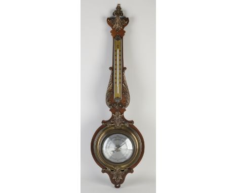 Mahogany barometer with brass.&nbsp;Second half of the 20th century.&nbsp;Western Germany.&nbsp;Dimensions: 79 cm.&nbsp;In go