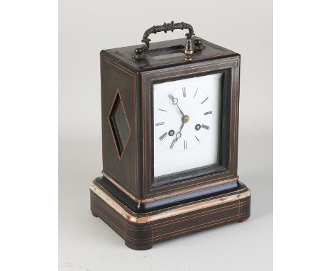 19th century French travel clock.&nbsp;Rosewood with band intarsia.&nbsp;Eight-day movement, half-hourly strike and spring pe