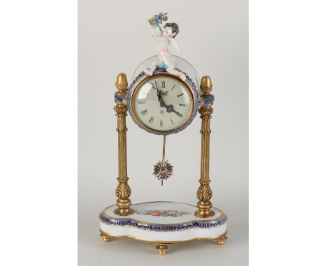 Italian Naples porcelain mantel clock with brass.&nbsp;Second half of the 20th century.&nbsp;Eight-day silent movement, one w