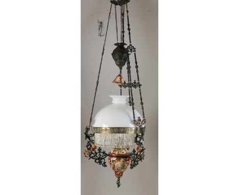 Antique majolica hanging petroleum lamp with floral decor.&nbsp;Jugendstil.&nbsp;Circa 1900. Dimensions: 70 x Ø 50 cm.&nbsp;I