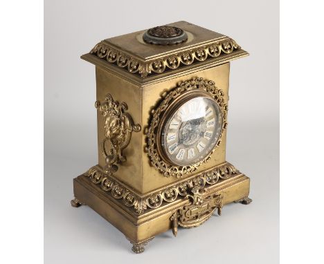 Antique French brass mantel clock with lion heads.&nbsp;Circa 1900. Eight-day movement, half-hourly strike on bell.&nbsp;Dime