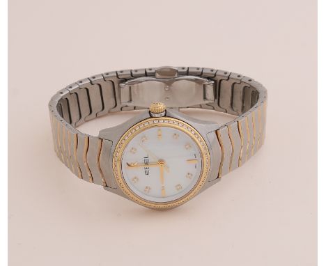 Ebel Wave ladies model, steel with gold, with mother-of-pearl dial with 8 diamonds and a bezel set with 58 diamonds.&nbsp;cas