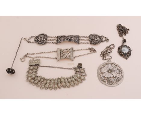 Lot of silver jewelery with 2 bracelets of bible locks, a pin with a Zeeland button, a pendant watch on a chain, large openwo