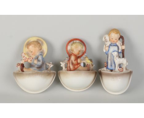 Three Hummel ceramic holy water wall bowls.&nbsp;W. Germany.&nbsp;Circa 1960. Size: 10 - 13 cm.&nbsp;In good condition.