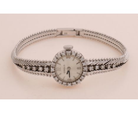 White gold watch, 585/000, with diamond.&nbsp;Ladies watch with a round case decorated with a bezel set with 20 brilliant cut