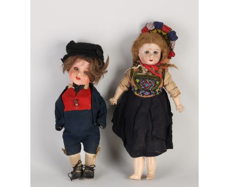 Two antique German dolls in traditional costume.&nbsp;1x Girls doll Carl Wernicke, porcelain + articulated body 120/3.0.&nbsp