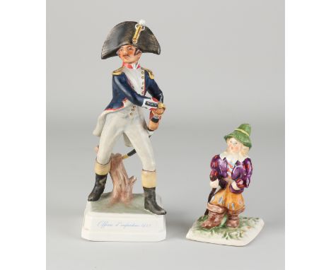 Two Goebel figures.&nbsp;Germany.&nbsp;(1) Officer 'd infantry 1812, (1938).&nbsp;(2) Child with big boots, 1935. Size: 12 - 