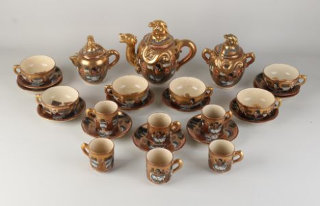 Antique Japanese porcelain Satsuma tea set.&nbsp;Fifteen-piece.&nbsp;Circa 1900. Size: 5 - 19 cm.&nbsp;In good condition.