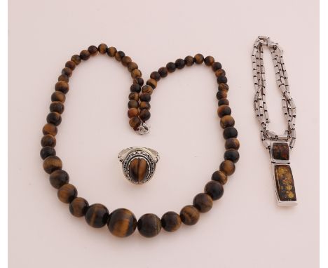 Lot of jewelery with a necklace of tiger eye beads, varying in size 7-14 mm, 48 cm, a silver ring with oval tiger eye, ø 57, 