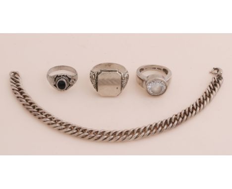Lot of silver jewelery with 3 rings, a signet ring, a ring with onyx and a ring with large cubic zirconia.&nbsp;And a bracele