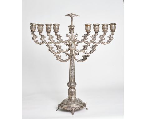 A RUSSIAN STERLING SILVER HANUKKAH LAMPWITH DETACHABLE OIL JUGDECORATED WITH FLORAL PATTERN IN THE FORMOF ROSE BUDS ON THE CA