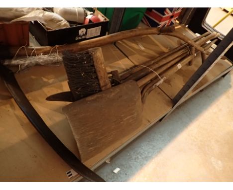 Bundle of tools and a scythe with sharpening stone 