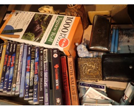 Shelf of mixed items including DVDs