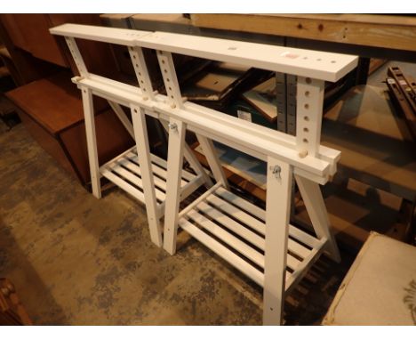 Pair of white saw bench style desk supports 