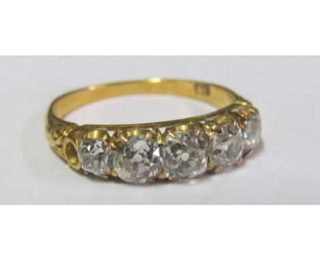 A diamond ring five graduated stones on 18ct gold band, ring size O