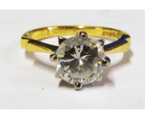 An 18ct gold single stone diamond ring with two obvious inclusions, approximately 1.5 carat spread