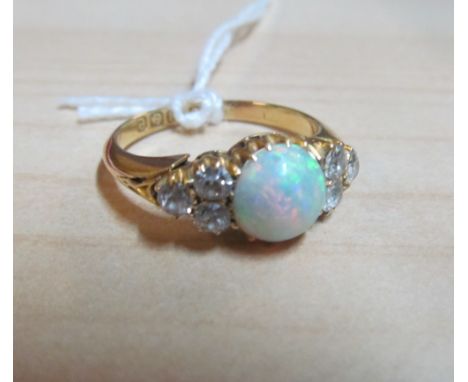 An 18ct gold opal and diamond ring size Q 4.4g