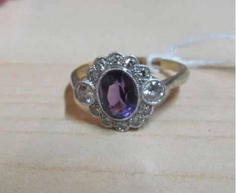 An 18ct gold and platinum amethyst cluster ring size P 3.3g