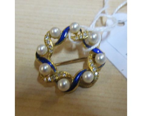 An 18ct gold pearl and enamel brooch 5.6g