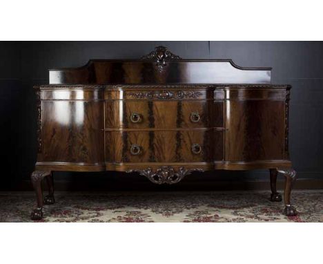 MAHOGANY SHAPED FRONT SIDEBOARD OF CHIPPENDALE DESIGN 
the low raised back with central scroll cresting, two central drawers 