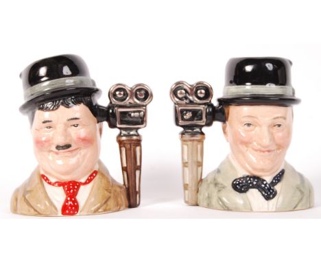 A pair of vintage Royal Doulton made ceramic ' Laurel &amp; Hardy ' character jugs D7009 and D7008. Limited edition, both No.