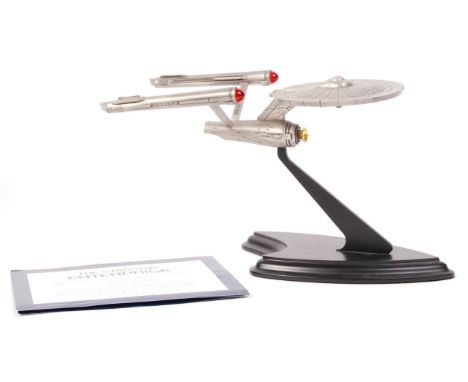 A Franklin Mint made Star Trek ' The Starship Enterprise ' precision scale display model in pewter. Appears mint, and includi