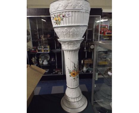 A Ceramic Continental Jardiniere Stand Painted in Multi Coloured Enamels Depicting Flowers and Swags.  