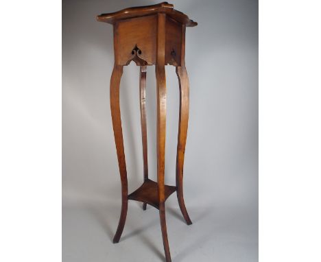 A Walnut Jardiniere Stand with Stretcher Shelf. 