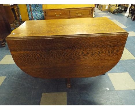 An Oak Drop Leaf Gate Leg Dining Table.