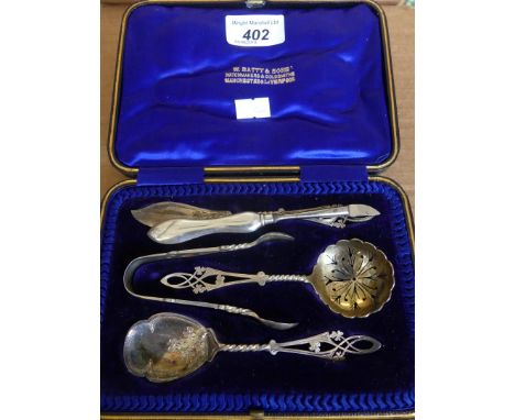 A cased set of hallmarked silver butter knives, sugar sifter, sugar spoon and sugar tongs together with a further silver hand