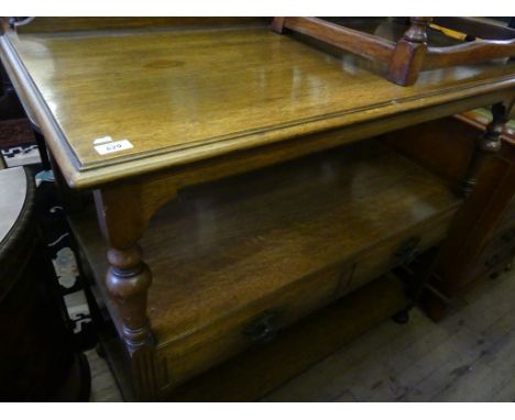 A late 19th Century oak buffet or side cabinet, with two frieze drawers