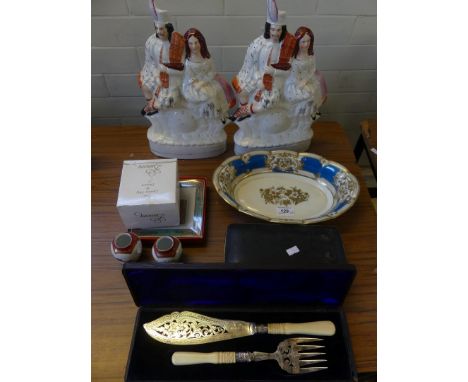 A mixed lot comprising a pair of Staffordshire flatback clock figures, silver-plated fish servers, silver-plated cutlery with