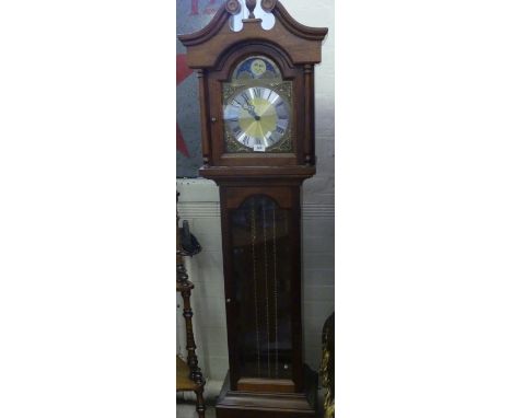 A 20th Century Grandmother clock with moonphase detail and triple weight movement in a dark stained mahogany finish case 