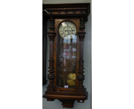 A late 19th Century walnut cased Vienna regulator type wall clock