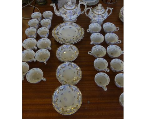 A collection of 19th Century blue and gilt floral decorated tea wares possibly Spode, some pieces bearing number 374 to base.