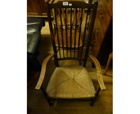 A 19th Century large rectangular waxed pine kitchen table on turned legs together with four wheel back kitchen chairs and a 1