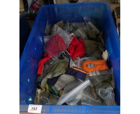 A box of various Action Man outfits and others