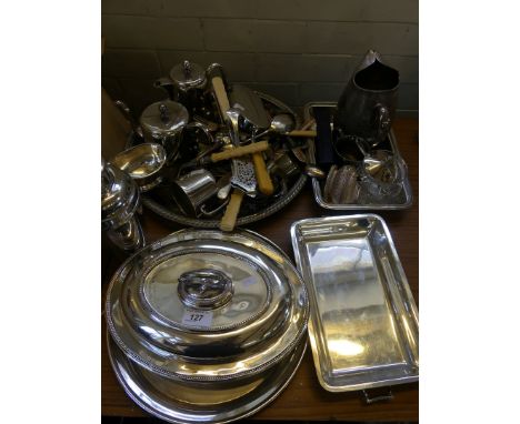 A mixed lot of assorted silver-plated items to include entree dishes, tea ware, cocktail shaker, various cutlery, serving tra