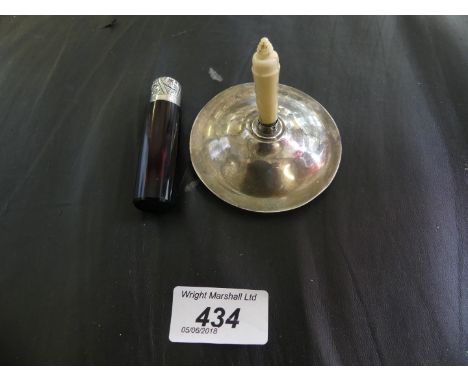 A small silver topped and ruby glassed scent bottle together with a further silver ring stand 