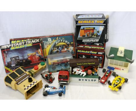 Collection of Scalextric slot racing accessories including C700 Dunlop bridge, C170 Rev-start pack, C703 pit stop, C702 contr