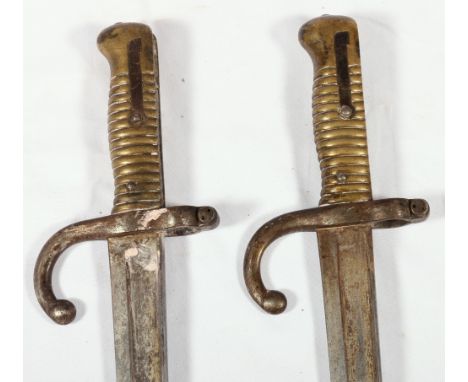 Two French model 66 sword bayonets (sabre-baionette mle 66) having fullered yataghan blades marked to the edge 'Mre Imple de 