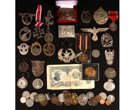 Collection of German Nazi Third Reich badges and medals including black iron cross, War Merit KVM, Anschluss medal 13th march