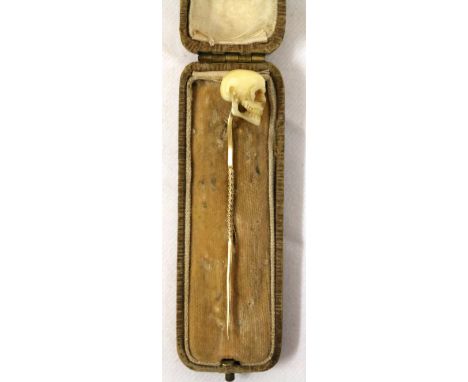 Early 20th century tie pin, the finial in the form of a skull and carved from bone CONDITION REPORT: Restored cheek bone, the
