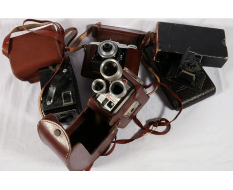 Collection of six vintage cameras including Kodak Brownie movie camera, 2 Kodak folding bellows cameras, Agfa Isoletle camera