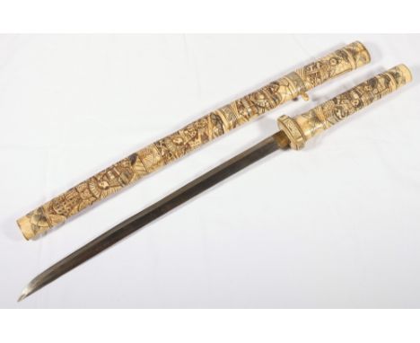 Japanese bone mounted wakazashi the scabbard and grip decorated with warriors, blade length 40cm, sword length 60cm