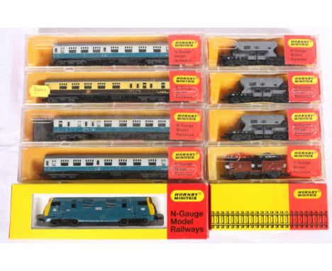 Collection of Hornby Minitrix N gauge model railways including N206 Hermes warship class diesel locomotive, four coaches, fou