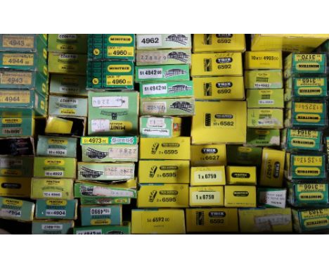 Collection of Minitrix N gauge model railways including 12 wagons and rolling stock, various points, rail and other accessori
